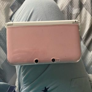 Nintendo 3ds xl -pink and Nintendo xl with 25 games and bags